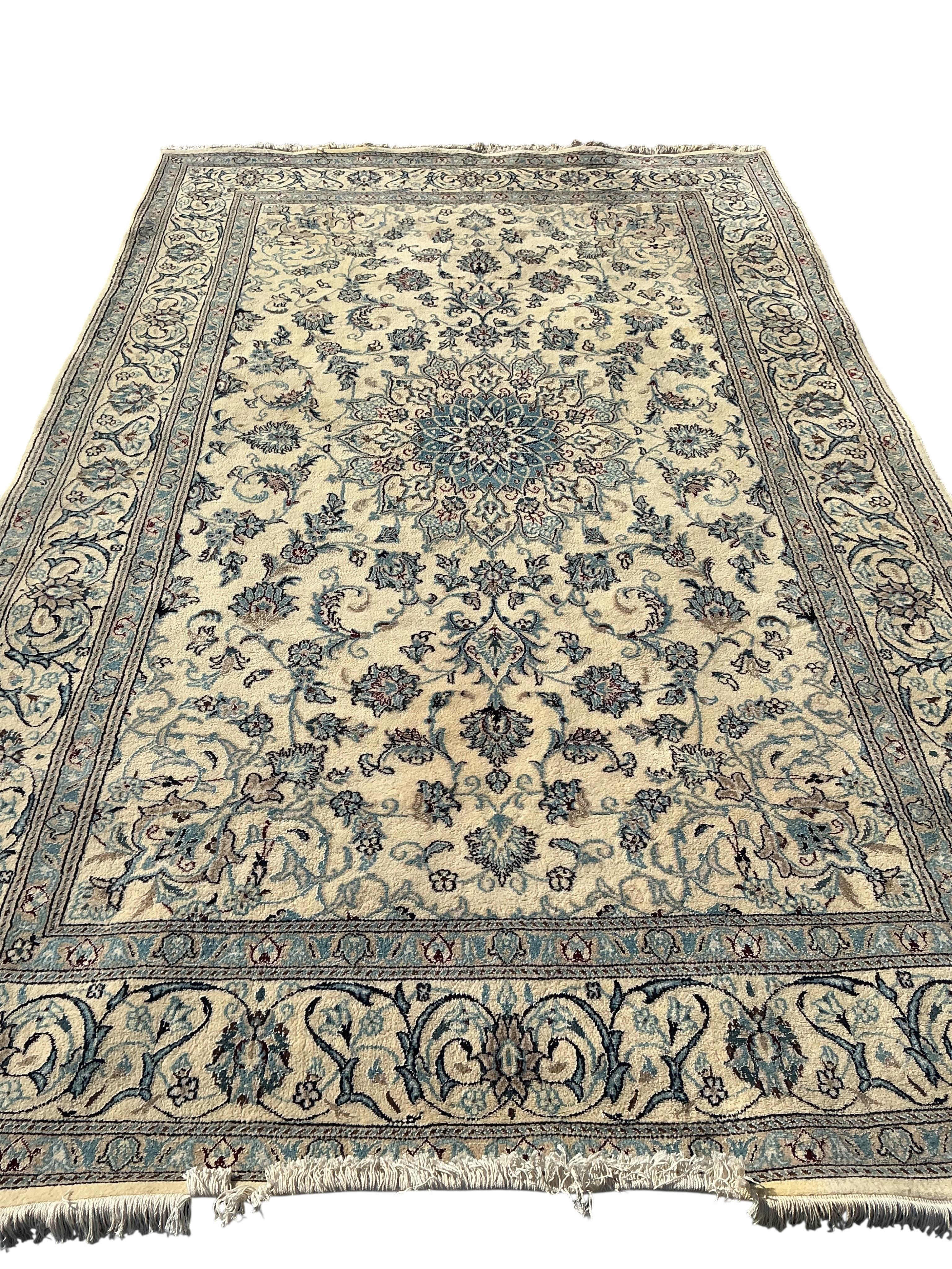 A Tabriz ivory ground carpet, 310 x 195cm